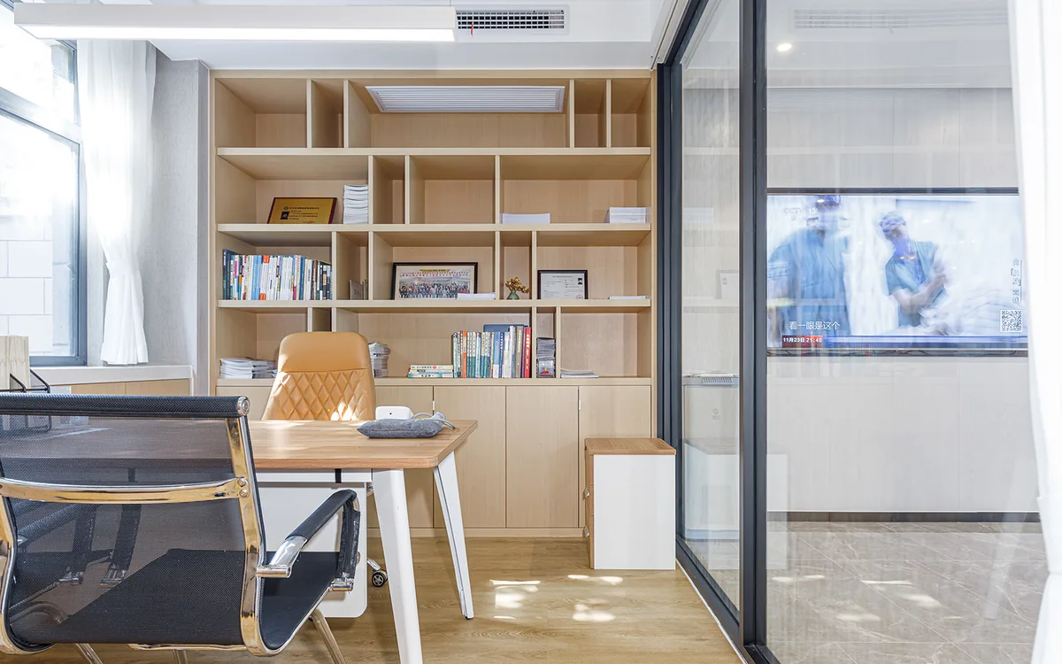 Private consultation room with a desk and bookcase