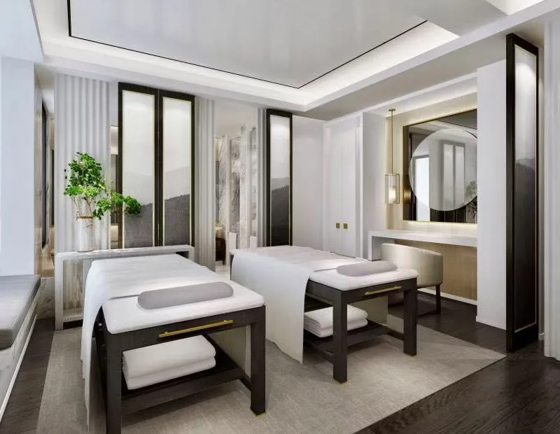 Private treatment suite with two prepared beds