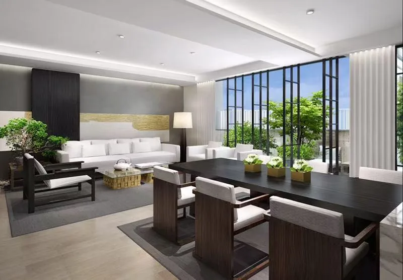 Spacious treatment lounge with seating and garden views